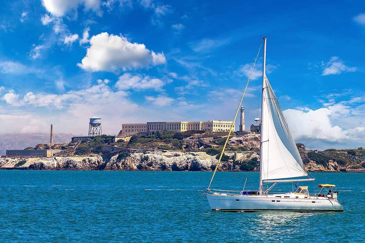 Yacht sailing past Alcatraz in San Francisco Bay