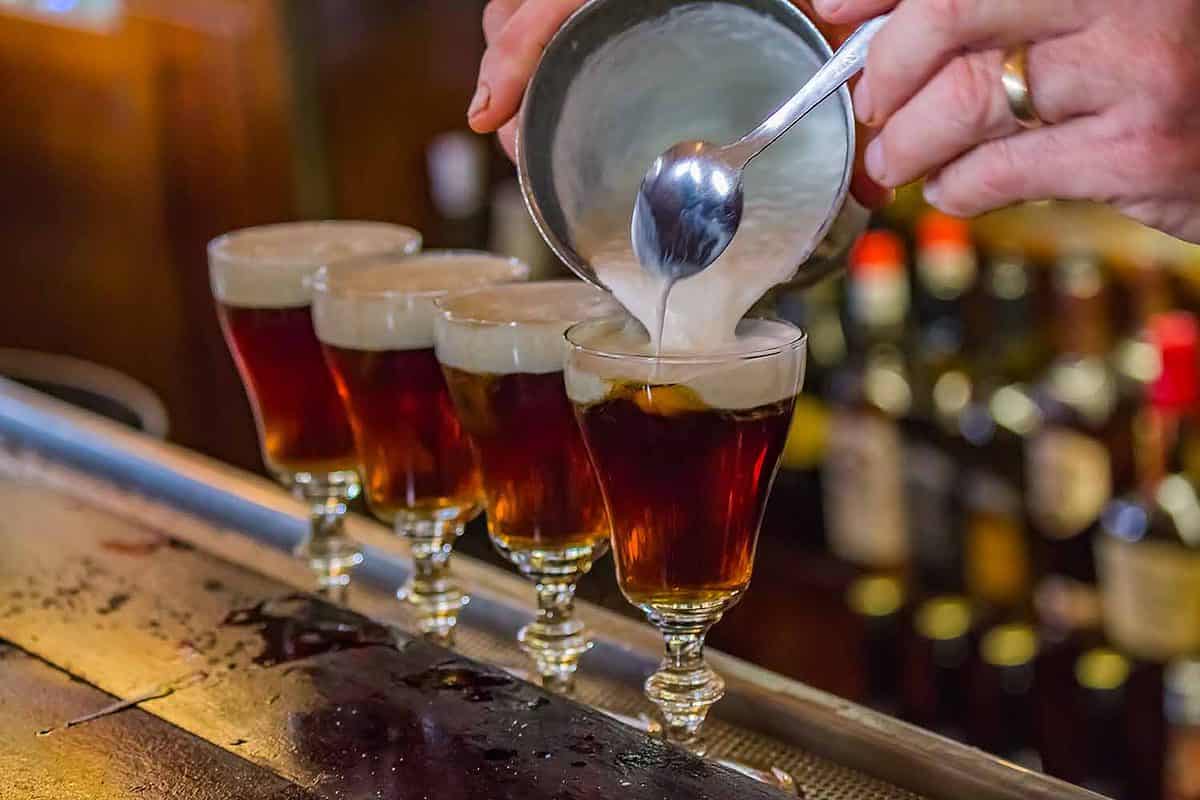 Irish Coffee drinks being made on the bar counter at the famous Buena Vista cafe where it was invented, near the Powell Hyde cable car line