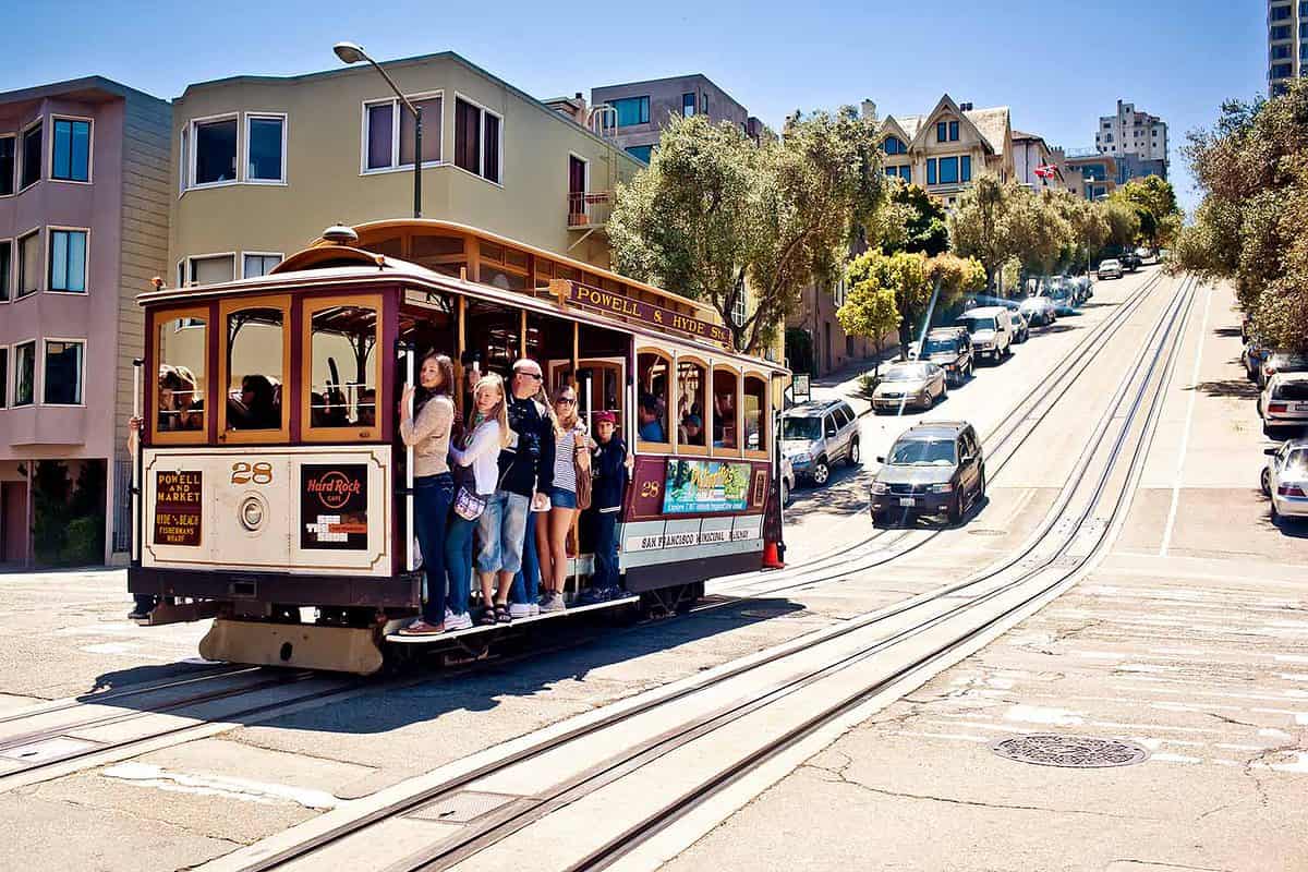 Passengers enjoy a ride in a cable car on July 22, 2011 in San Francisco. It is the oldest mechanical public transport in San Francisco which is in service since 1873.