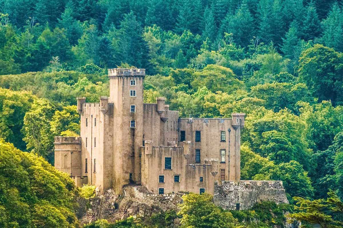 Dunvegan Castle exterior - A beautiful castle of golden stone set into the hills