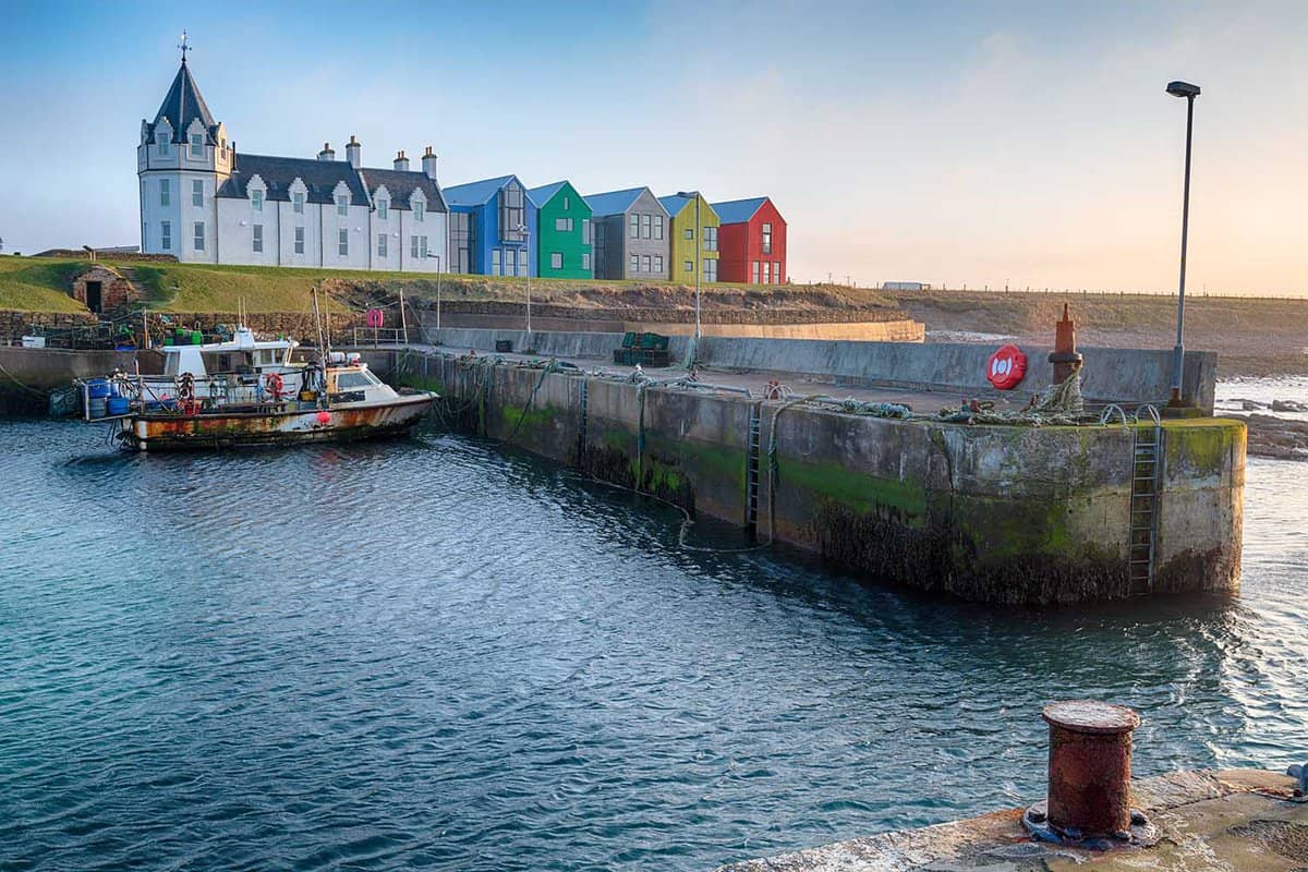 Colourful houses and a stone pier