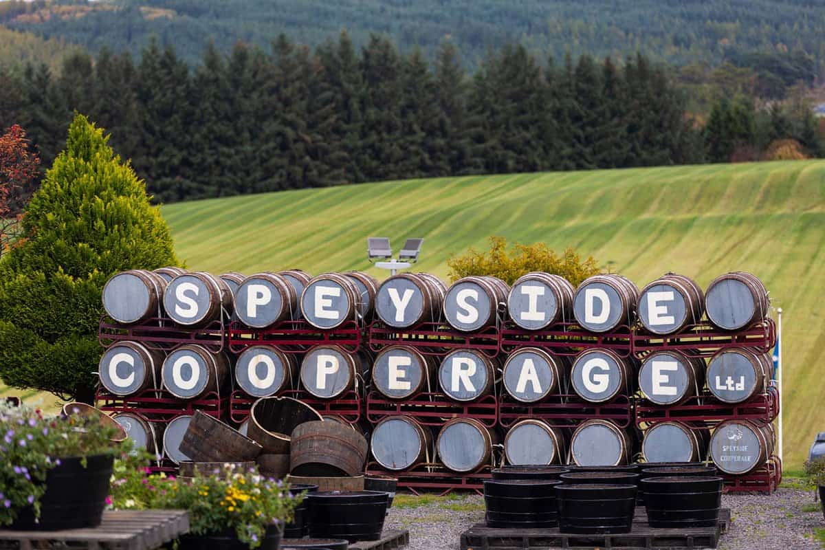 Sign made from whiskey barrels piled on top of each other in 3 rows