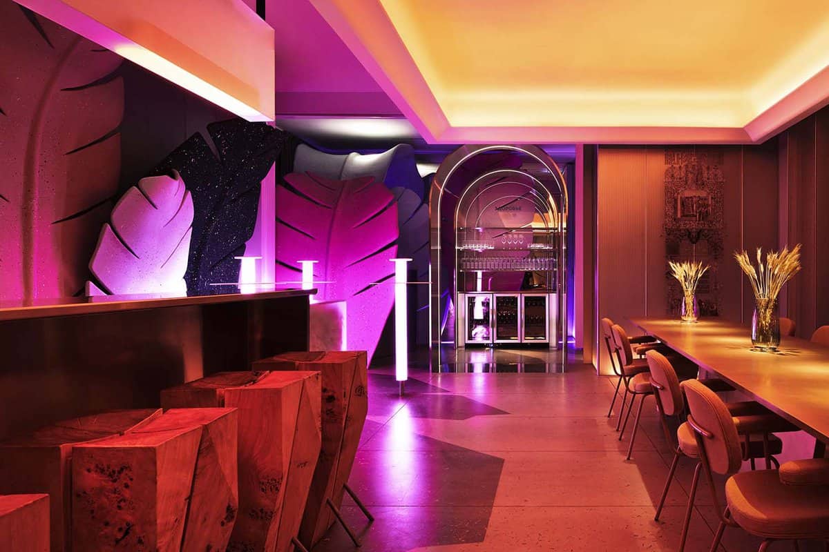 Hotel bar lit in purple and pink