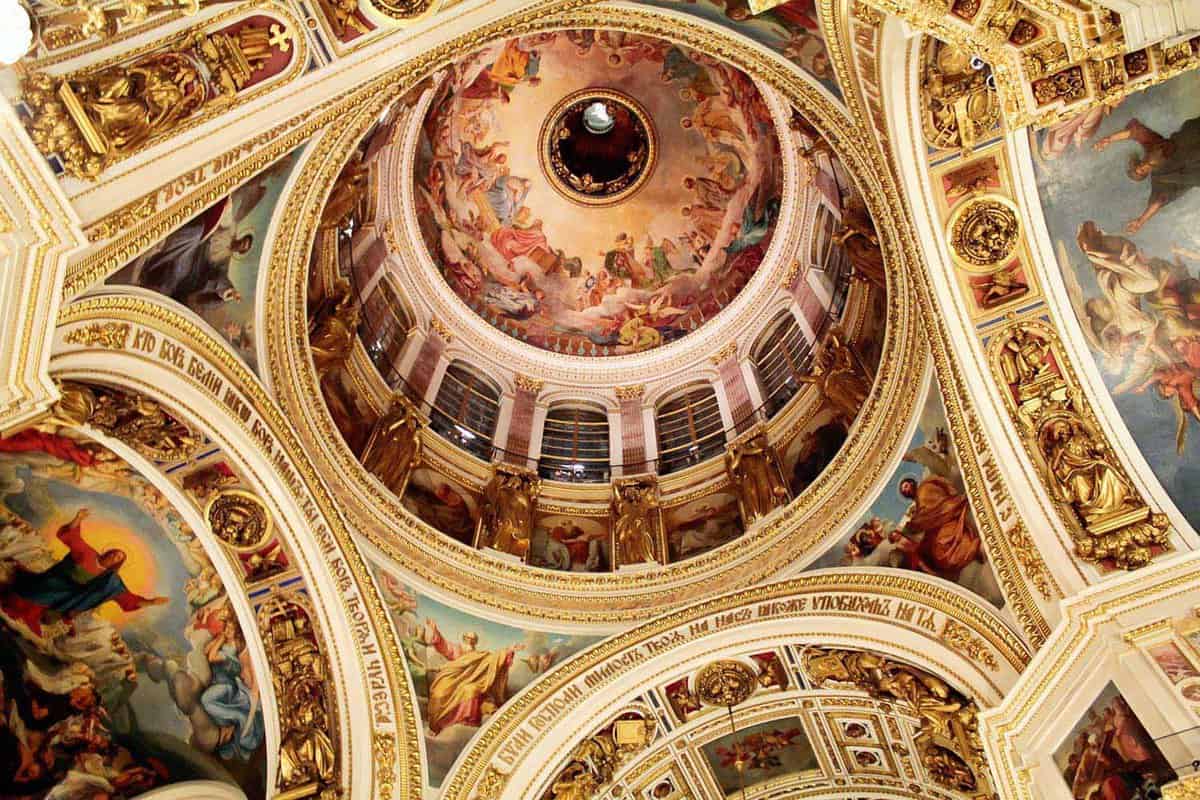 Interior of cathedral dome with paintings and gold decoration