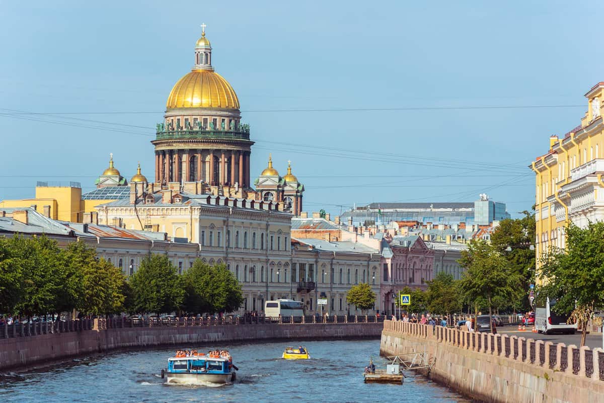 St. Isaac's Cathedral and the old town houses along the Moyka River with a sightseeing boat.