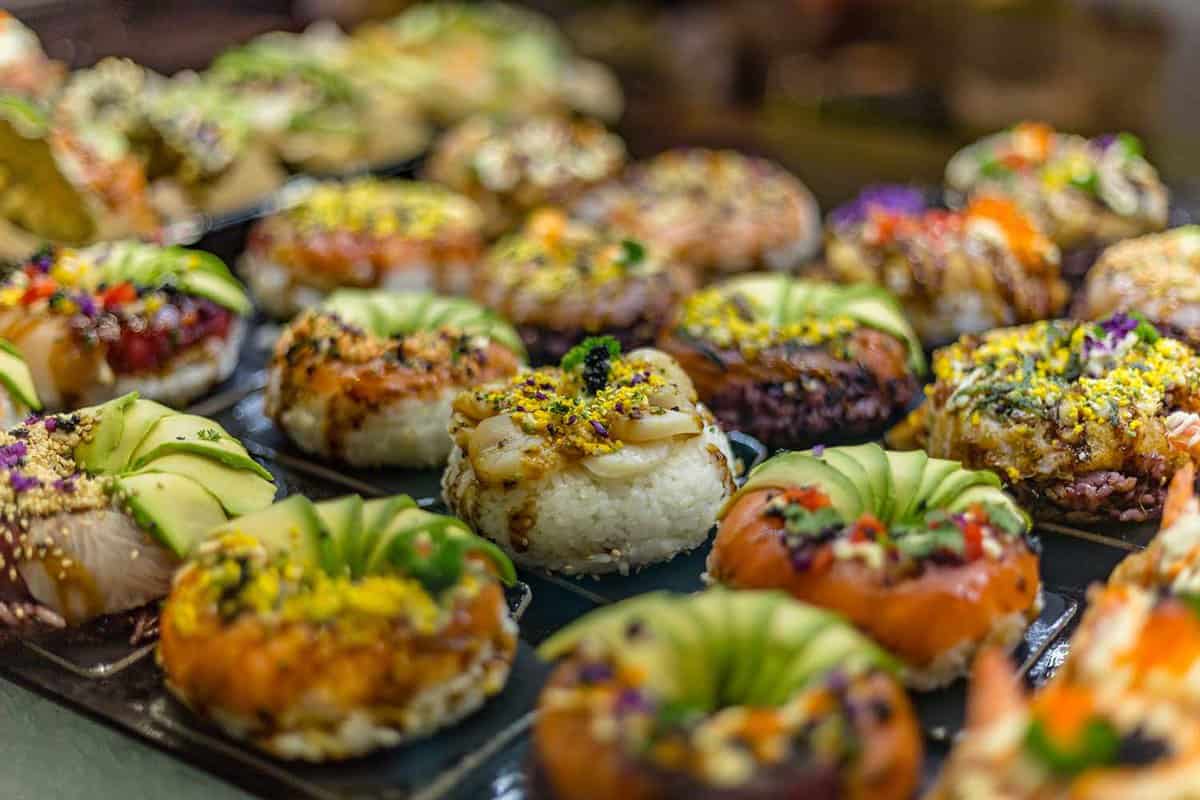 A close up of lots of sushi donuts.