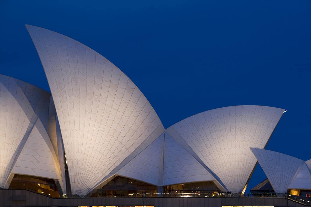 A side view of Sydney Opera House at night.