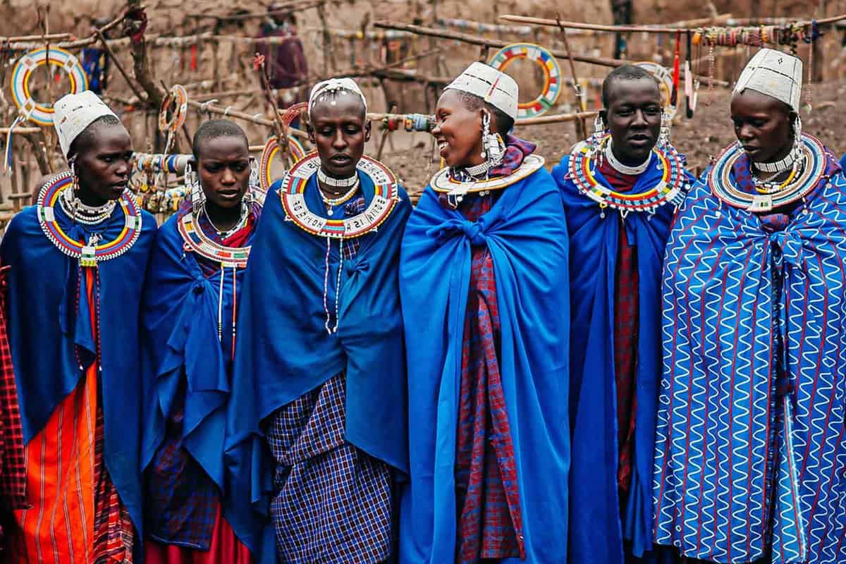 group of 6 local tribeswomen in colourful dress
