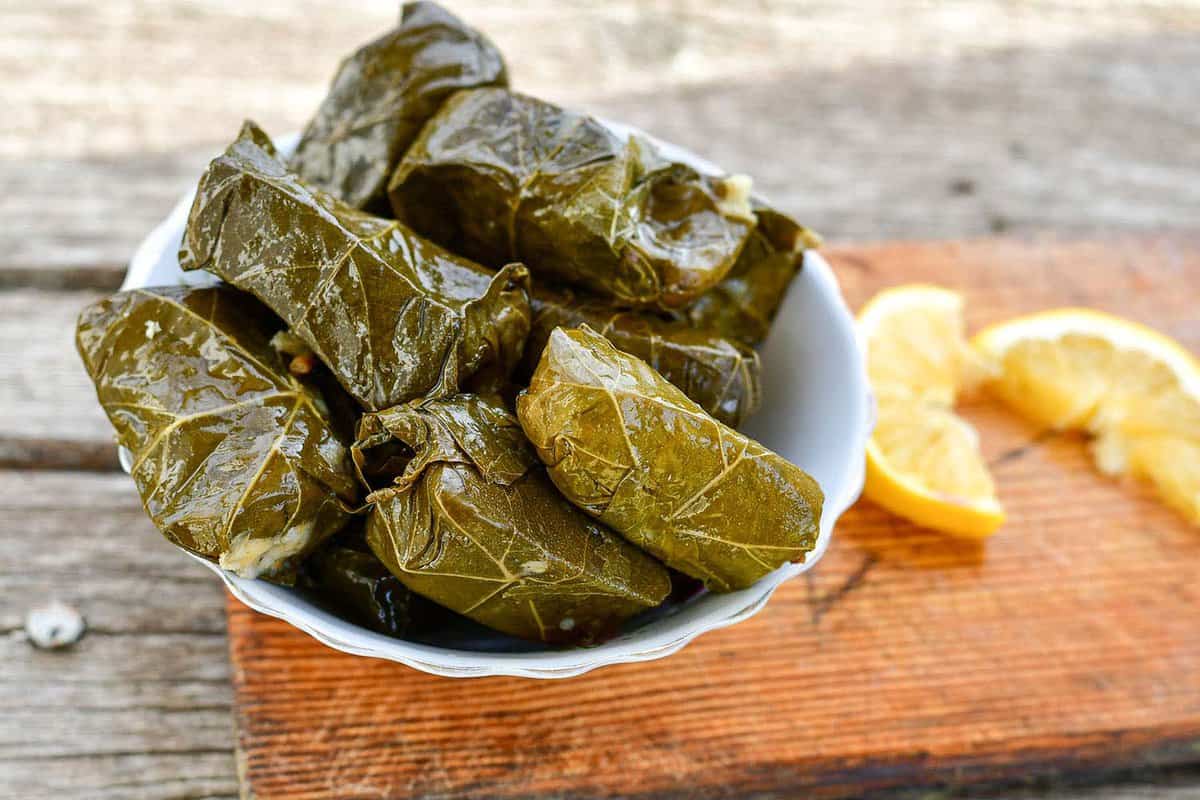 close up of Dolmades - stuffed grape leaves filled with rive