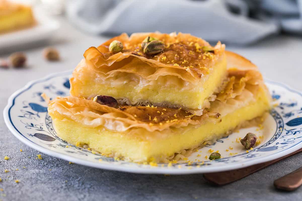 close up of a slice of galaktoboureko - a custard and honey desert