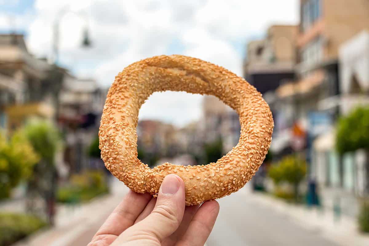 close up of a person holding up a Koulouri ring
