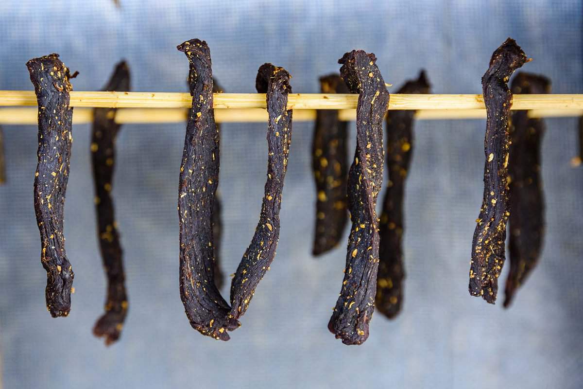 South african meat biltong dries on wooden sticks