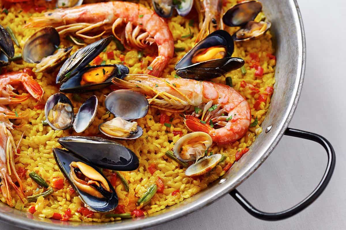 paella dish with rice, prawns and mussels
