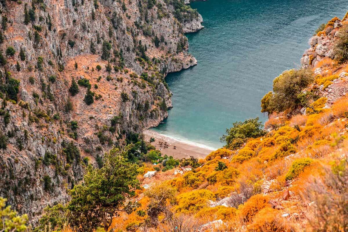 Aerial view of the valley with the turquoise sea visible below