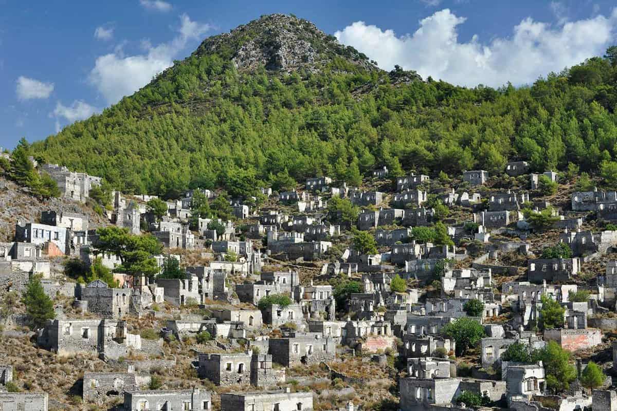 The abandoned town with a green mountain in the background