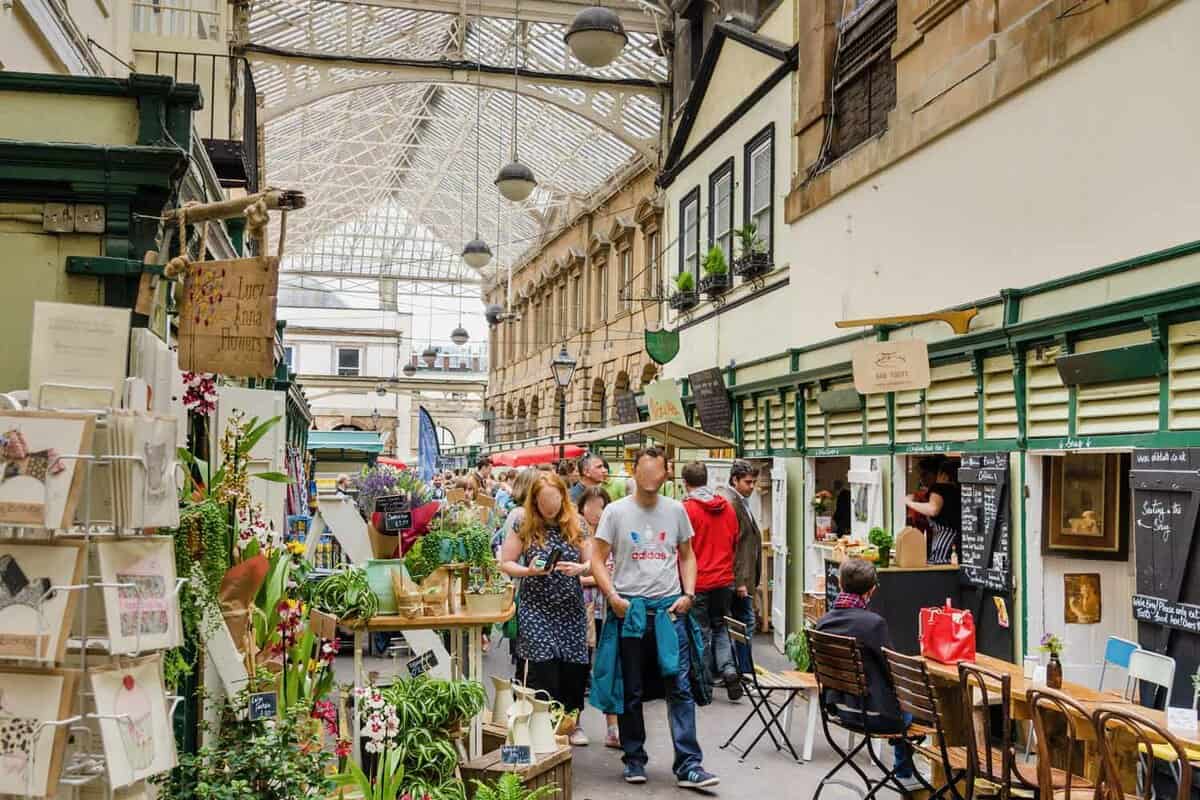 Indoor market lined with shops and cafes