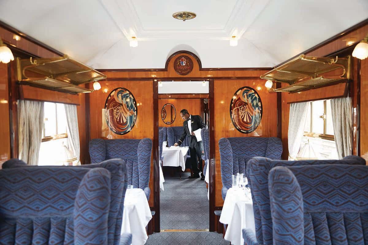 A waiter preparing a table in the main carriage