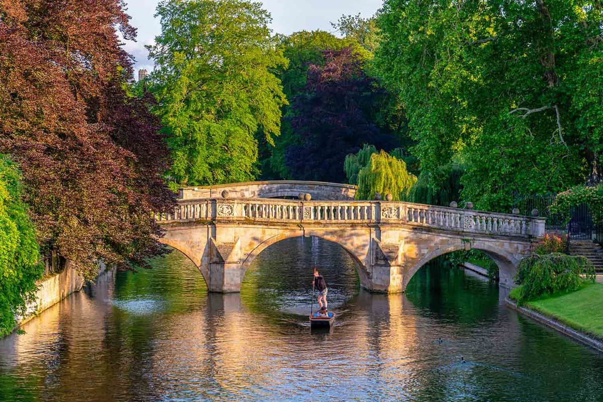 Traditional old stone bridge in Cambridge city in England viewed at golden hour