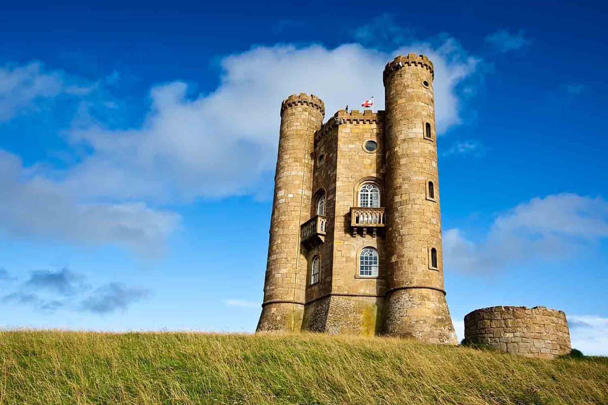 Exterior of a tower on a hill on a sunny day.