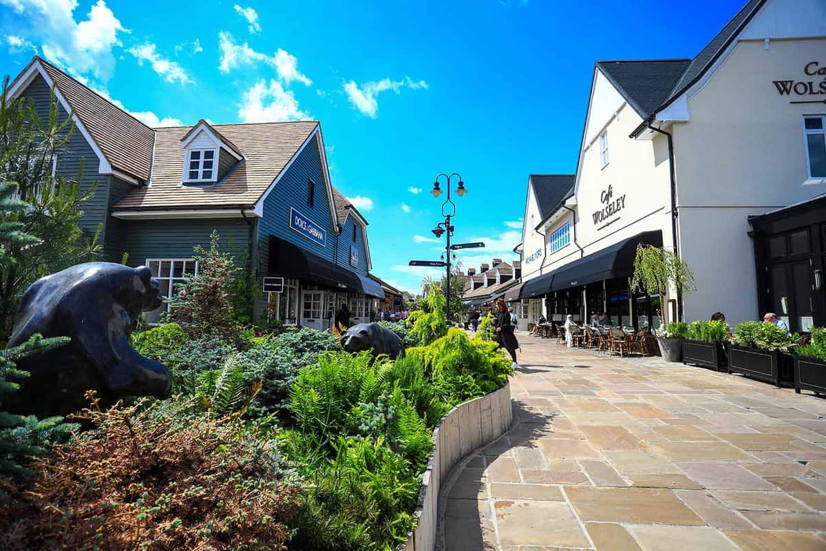 A street with luxury shops on either side.