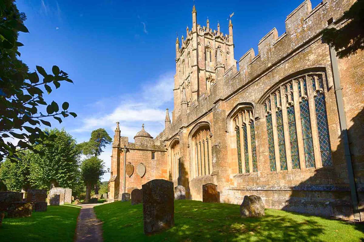 St James Church and graveyard in old Cotswold town of Chipping Campden .Side view of a church with graves in front.