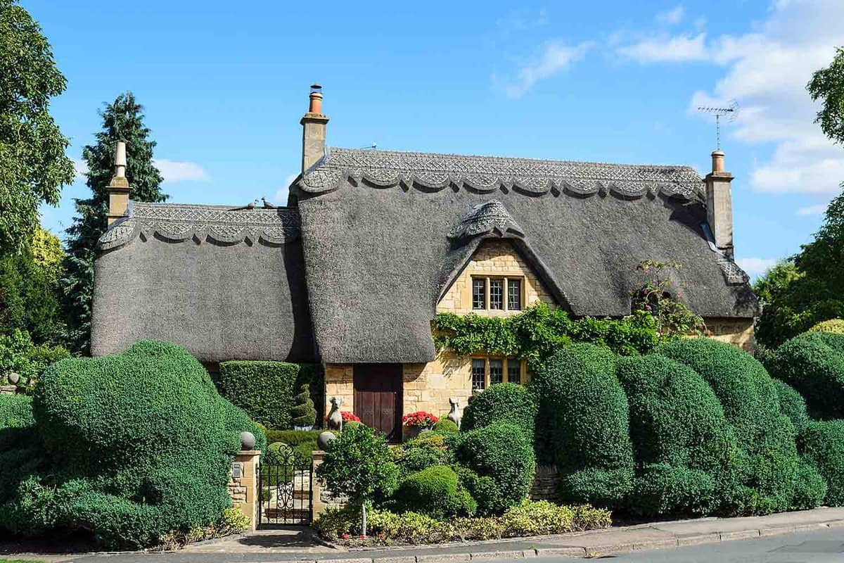 Exterior of an old-fashioned thatched cottage