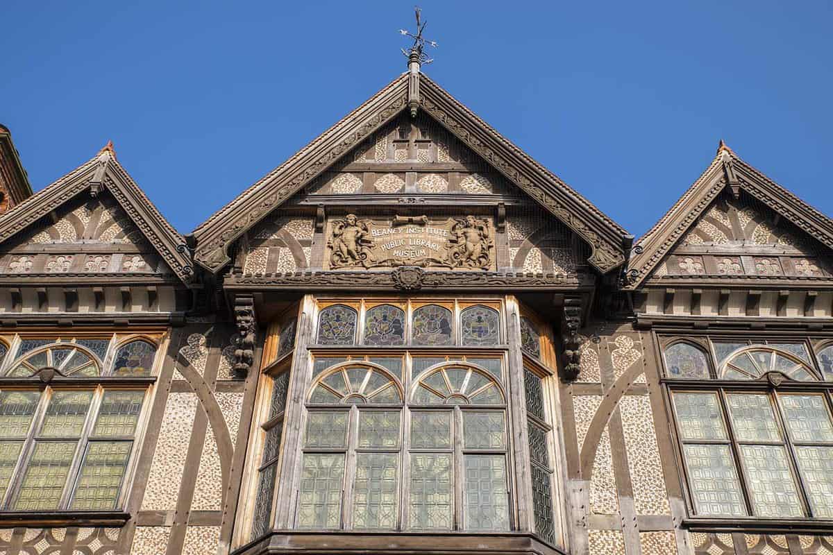 Close up of the roof and window of Tudor-style building