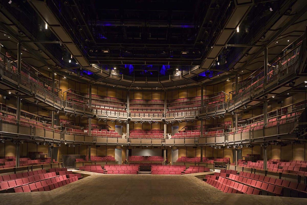 An inside view of the breathtaking Royal Shakespeare Company theatre in Stratford-upon-Avon. Displaying the heightened structured red seats in the theatre
