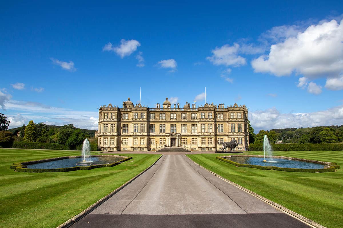 A landscape of Longleat Safari & Adventure Park house on a sunny blue day