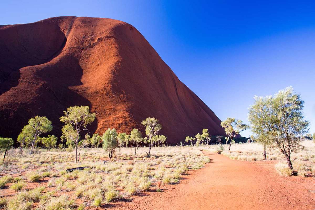 A face of a red mountain on a clear winter's afternoon