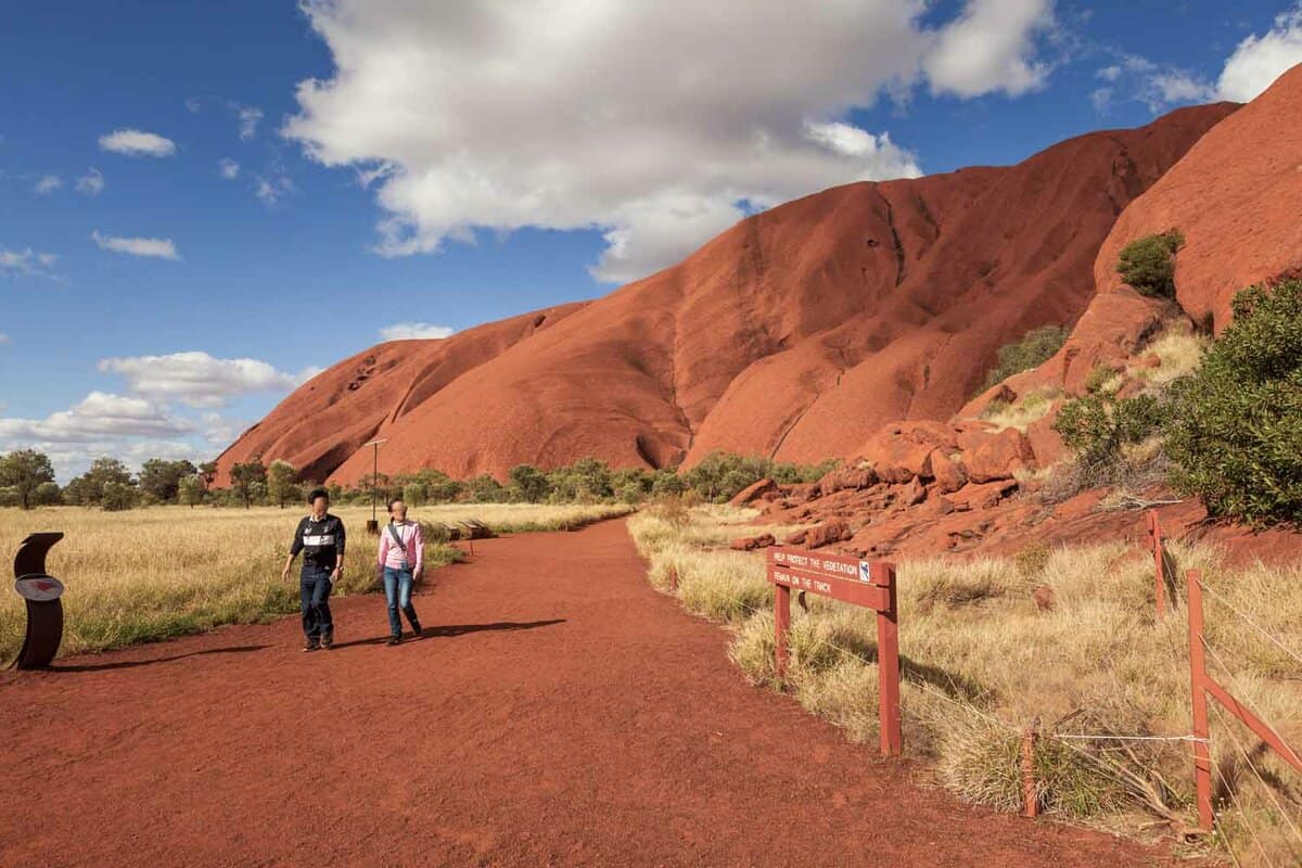 A red pathway on the bottom of a red mountain.