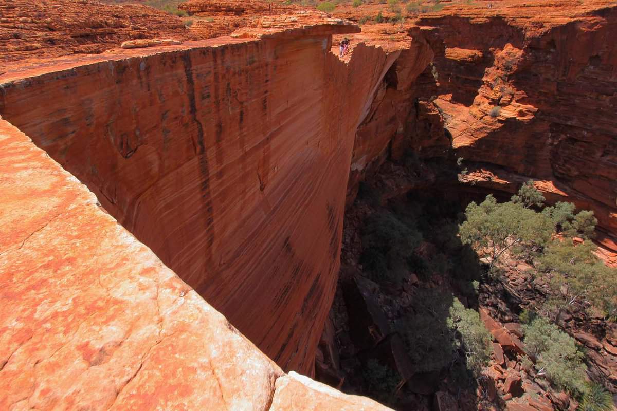 A red cliff face, from on the cliff