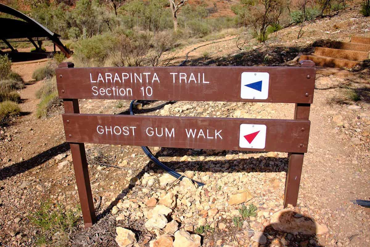 A sign reading Larapinta trail and Gum tree walk
