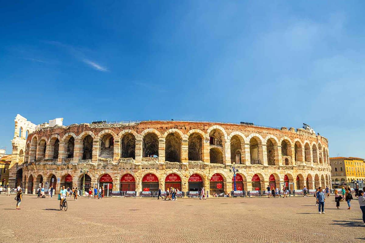 Verona Arena in Piazza Bra square. Roman amphitheatre Arena di Verona ancient building, sunny day, blue sky background, copy space, Verona city historical centre