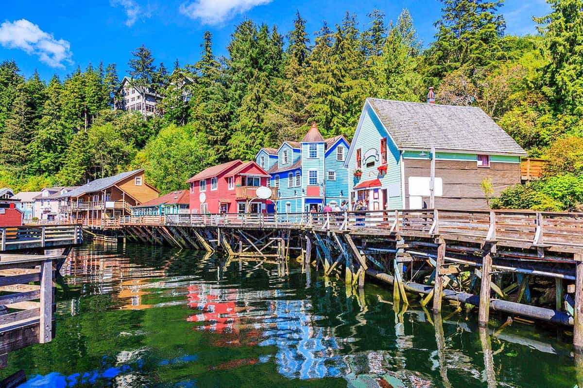 colourful small wooden houses on the waterfront jetty