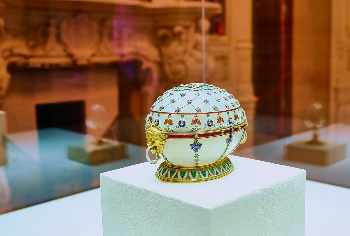 small decorated faberge egg in a display case