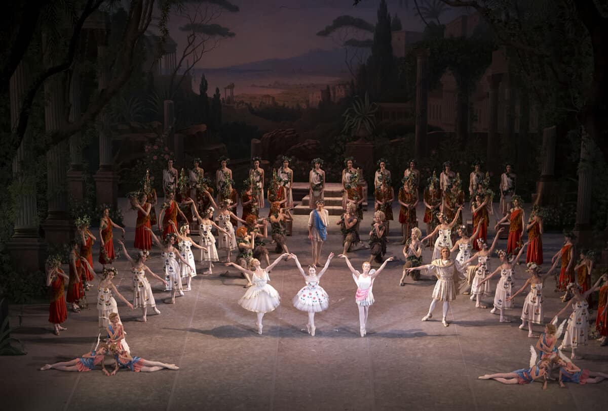A hundred ballet dancers performing on stage