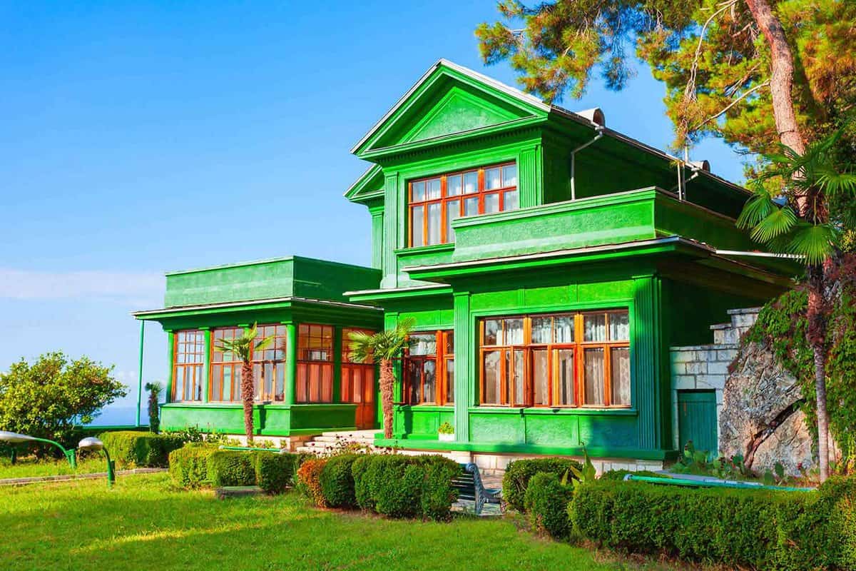 external facade of the bright green villa