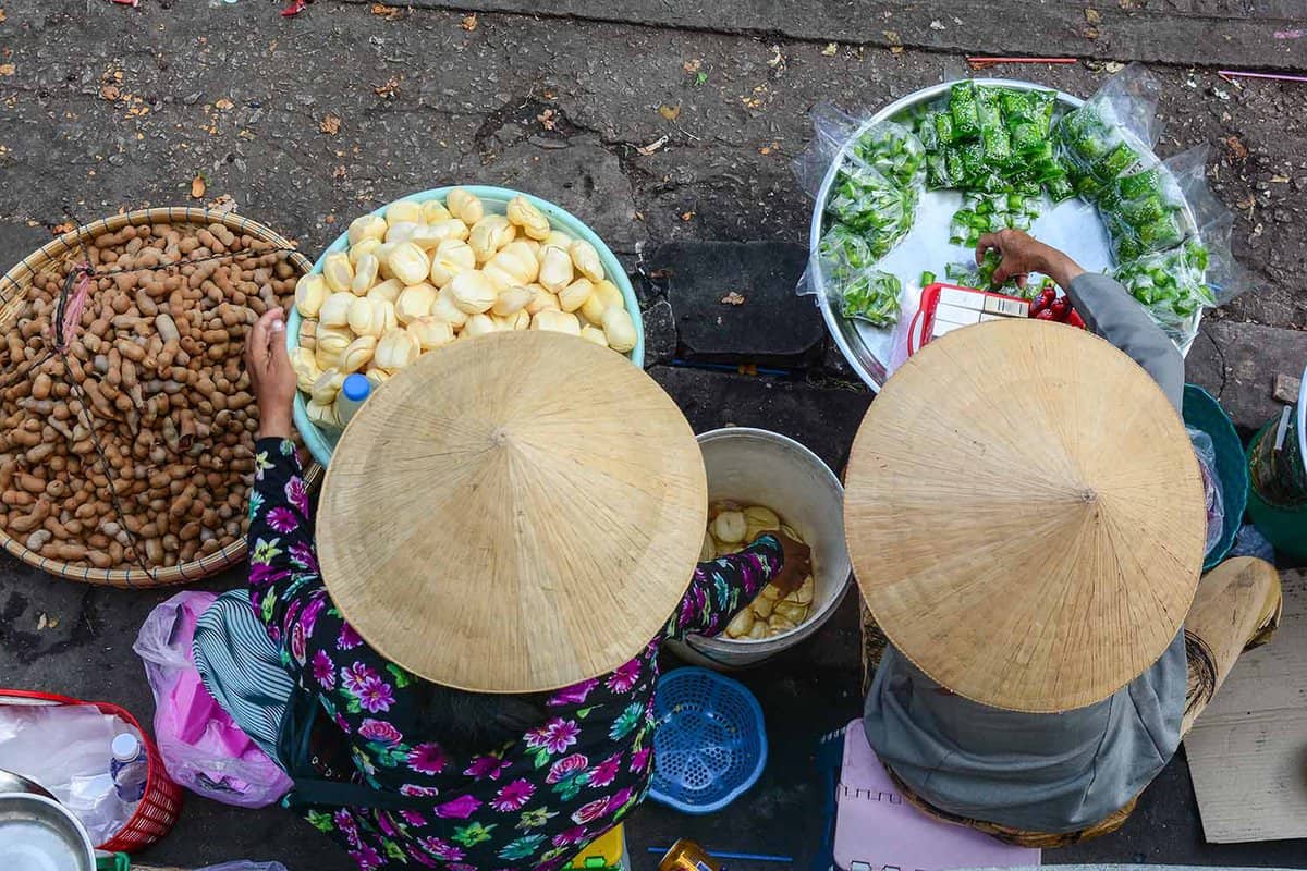 aerial view of vendors selling snacks on street in Ho Chi Minh city)