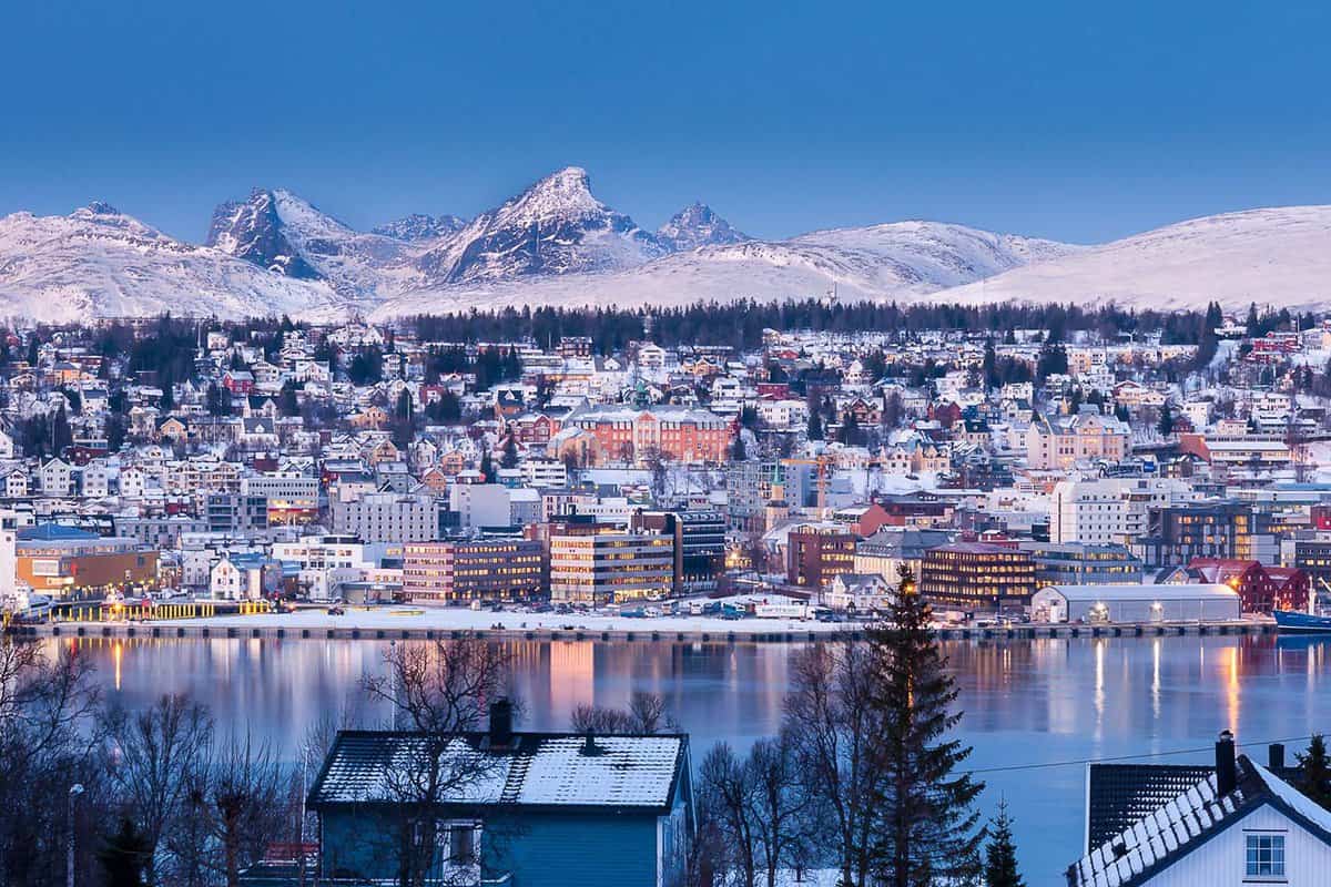 View of the snowy city at sunset