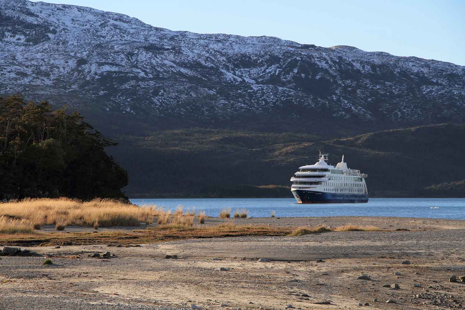 Cruise liner moored up in a barren landscape