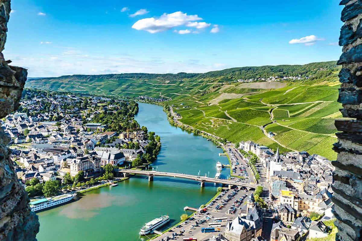 aerial view of city on banks of a large river running through the centre