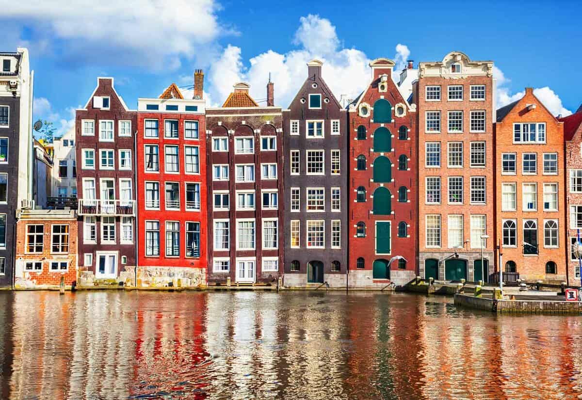 Colourful and charming merchant houses in Amsterdam on a canal
