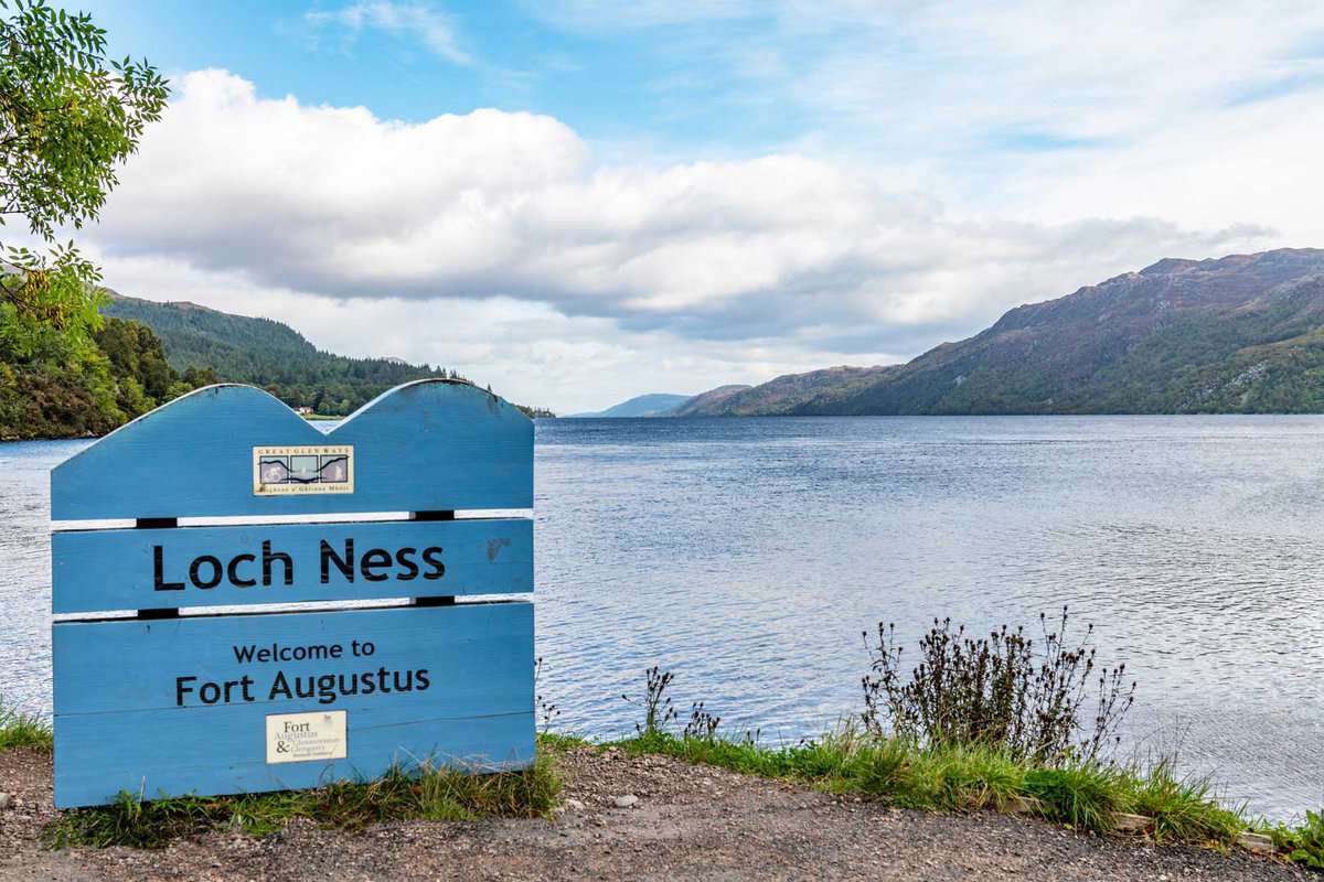 loch ness sign with the loch behind