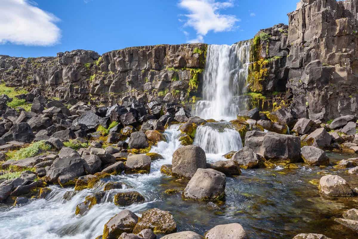 waterfall over rocky cliff