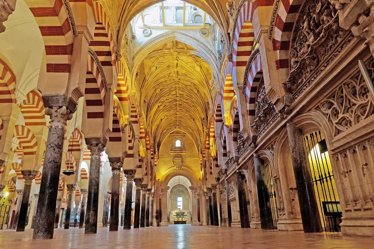 Interior of the Mezquita, large striped archways and a high ceiling